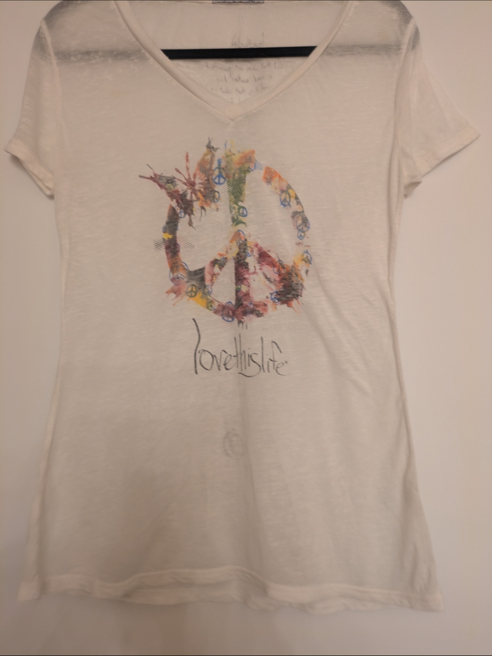 White V-Neck Short Sleeve Tee with Floral Peace Graphic